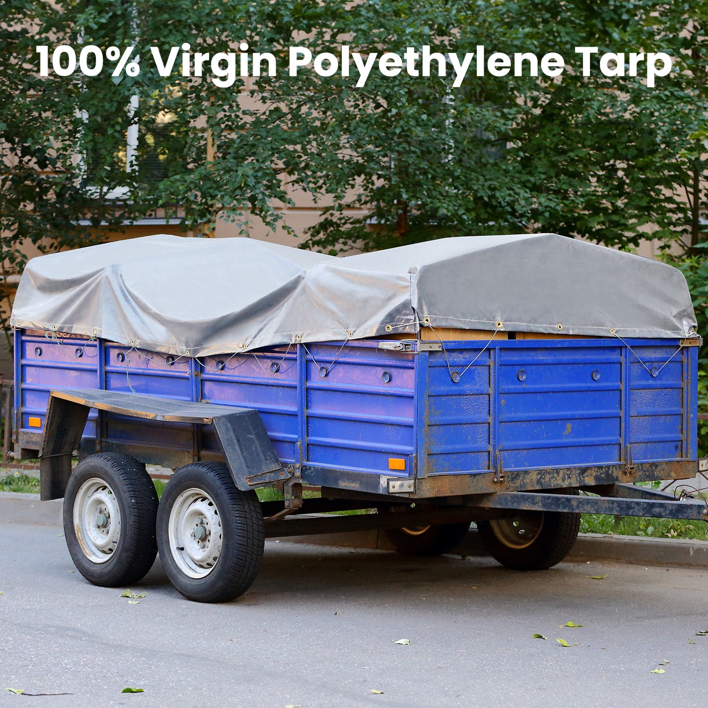 Blue trailer with a gray tarp on a road, featuring '100% Virgin Polyethylene Tarp' text.